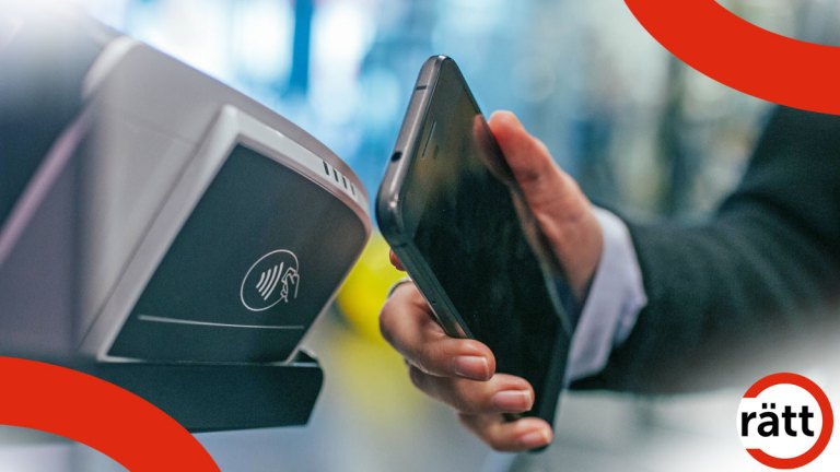 En mobil hålls upp mot en trådlös avläsare.